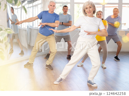 Elderly woman dances modern dances in group Elderly woman dances modern dances in group 124642258
