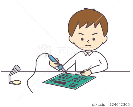 はんだ付けをする男の子 124642309