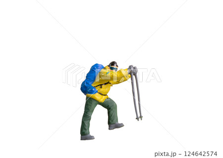 Miniature Figurine of a Trekker with Hiking Poles isolated on white background with clipping path Miniature Figurine of a Trekker with Hiking Poles isolated on white background with clipping path 124642574