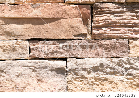stonewall background. Building material concept. Surface of stonewall. Textured stonemason backdrop. wall texture background. stone wall structure 124643538