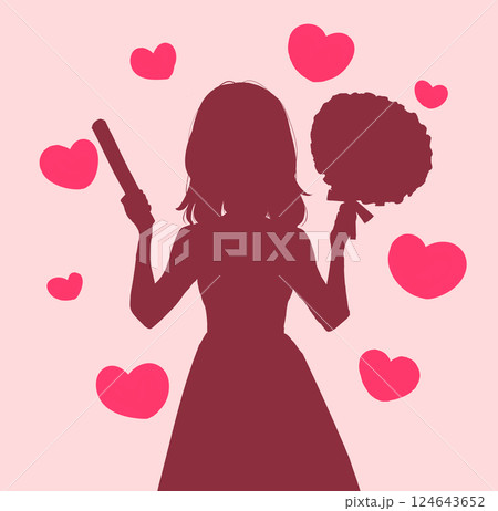 うちわとサイリウムを持って推し活をする女性　影絵　ハート 124643652