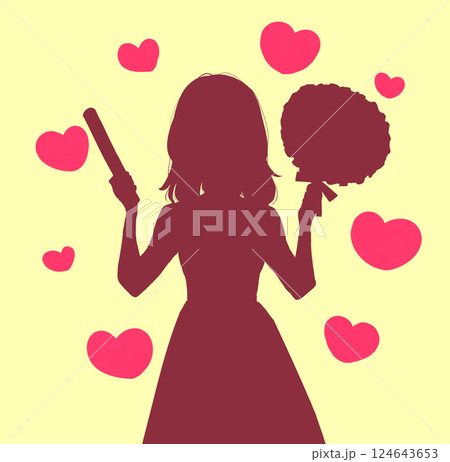 うちわとサイリウムを持って推し活をする女性　影絵　ハート 124643653