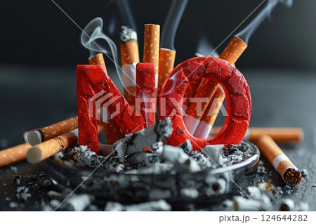 A pile of smoking cigarettes, butts and ashes, with big NO signs. Smoking kills. Smoking cessation, World No Tobacco Day campaign, No smoking 124644282