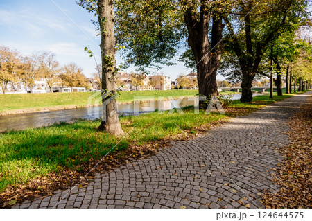 Park with a river running through it and a path Park with a river running through it and a path 124644575