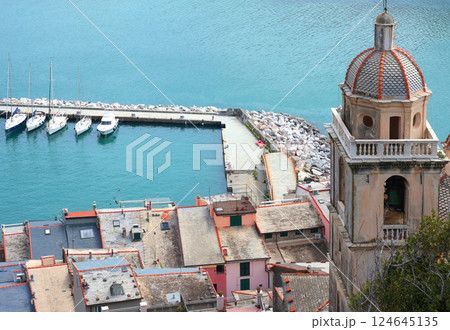 Yachts, boats in bay of Porto Venere, Liguria. Sea and tourism in Italy. Traditional buildings. Background for design.  124645135
