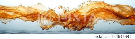 Ethereal scene of liquid gold blending with water creating delicate metallic smoke trails 124646449