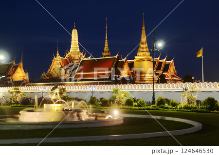 Beautiful lights decorate Wat Phra Kaew at sunset. This is a place of respect and tourism for Buddhists around the world. Located at Bangkok city in Thailand. Beautiful lights decorate Wat Phra Kaew at sunset. This is a place of respect and tourism for Buddhists around the world. Located at Bangkok city in Thailand. 124646530