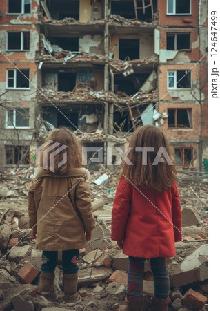 small kids standing in city destroyed by war, children in town demolished by earthquake, people and ruined buildings 124647499