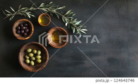 Variety of Olives and Olive Oil in Wooden Bowls on Rustic Banner Variety of Olives and Olive Oil in Wooden Bowls on Rustic Banner 124648746