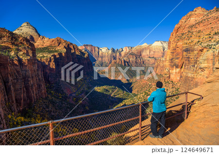 Tourist at Canyon Overlook in Zion National Park, Utah Tourist at Canyon Overlook in Zion National Park, Utah 124649671