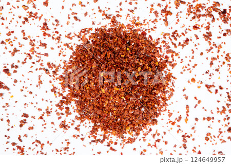Hot chili peppers crushed and dried, natural seasoning on a white background 124649957