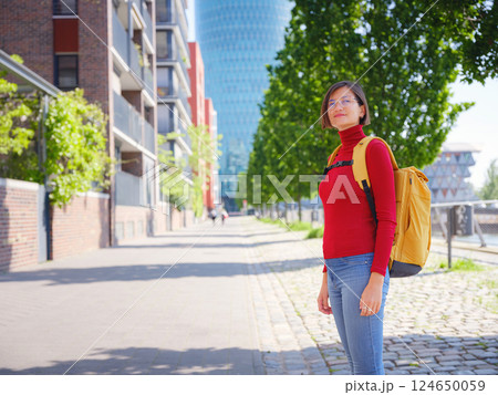 Tourist woman explores modern Frankfurt, 124650059