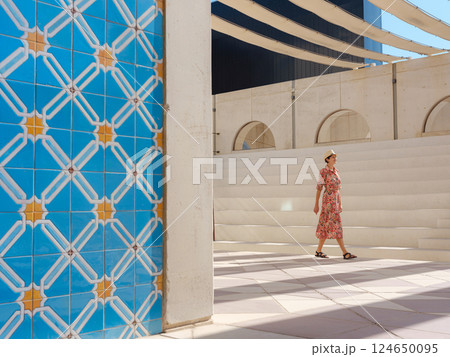 Young female tourist exploring iconic landmarks of the United Arab Emirates. 124650095