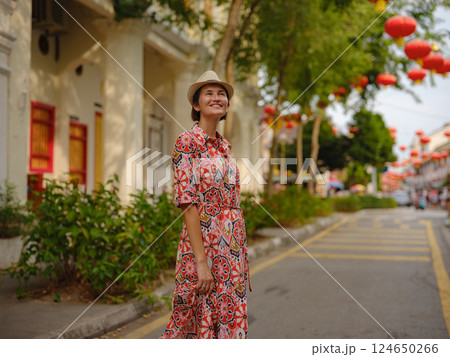 woman exploring streets of George Town, during Chinese New Year. woman exploring streets of George Town, during Chinese New Year. 124650266