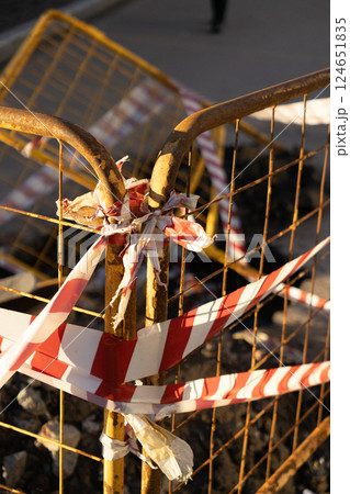 structure is metal with a red and white ribbon, dangerous territory. structure is metal with a red and white ribbon, dangerous territory. 124651835