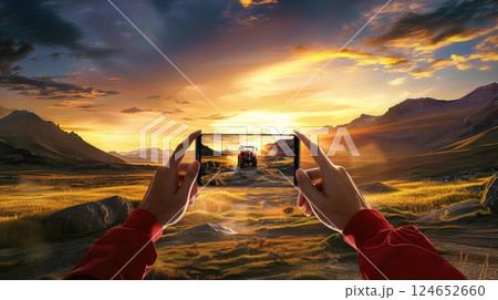 A farmer takes a photo of a working tractor on his field with a smartphone. The farmer enjoys a moment of pride as he captures his tractor working diligently in the field. 124652660