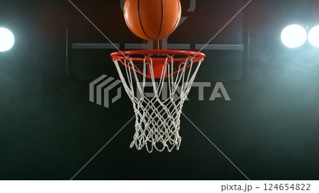 Freeze motion of basketball ball hitting the basket 124654822