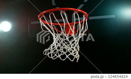 Freeze motion of basketball ball hitting the basket Freeze motion of basketball ball hitting the basket 124654824