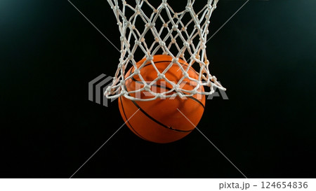 Freeze motion of basketball ball hitting the basket 124654836