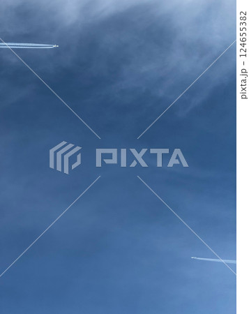 Two Airplanes Flying in Clear Blue Sky 124655382