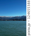 Wide View of Snowy Mountains and Coastal Waters Under Clear Sky 124655388