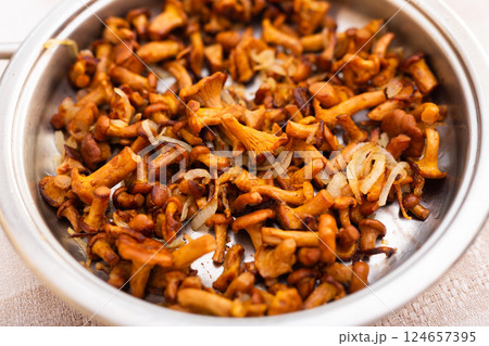 Delicious fried chanterelles in a frying pan 124657395