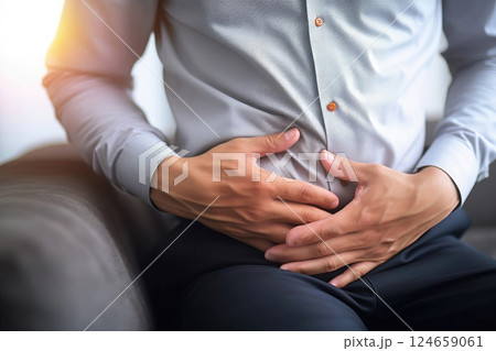 Faking Illness: Man Pretends Stomach Discomfort with Hand Gesture 124659061