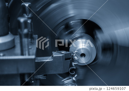 Closeup scene the lathe machine finish cut the metal parts in the light blue scene. 124659107