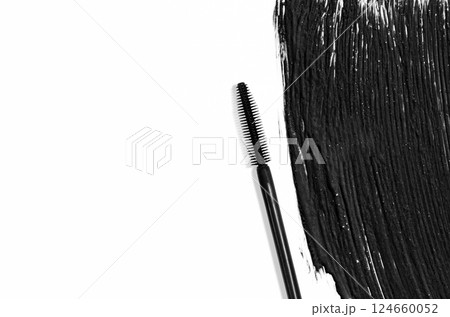 The texture of black mascara and an eyelash brush. Copy space 124660052