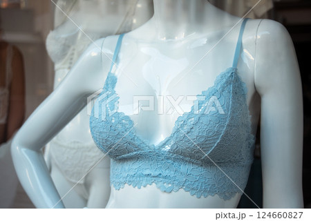 Closeup of blue bra on mannequin in a fashion store showroom Closeup of blue bra on mannequin in a fashion store showroom 124660827