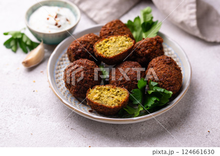 Middle Eastern falafel balls with sauce 124661630