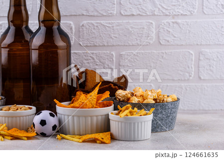 Beer and different snacks for Superbowl or football party Beer and different snacks for Superbowl or football party 124661635