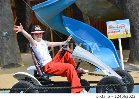Girl driving quad bike, four wheel cycle car, spring brightly morning, sunny day. High quality photo Girl driving quad bike, four wheel cycle car, spring brightly morning, sunny day. High quality photo 124662022