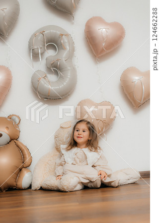 Child's girl 3rd Birthday Celebration with Balloons 124662288