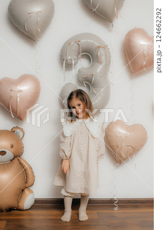 Child's girl 3rd Birthday Celebration with Balloons 124662292