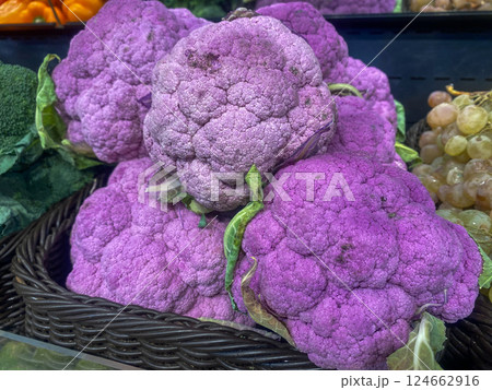 Purple cauliflower lies on the counter in the store 124662916