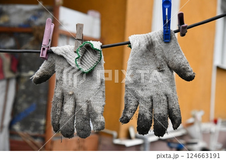 Old dirty glove on the forest ground. The left glove 124663191