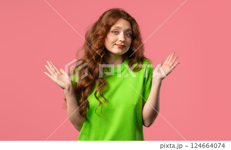 Confused pretty woman, shoulders up - can't help, makes gesture of I dont know. 124664074
