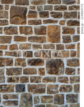 Old church wall with random handmade bricks and masonary old surface 124664172