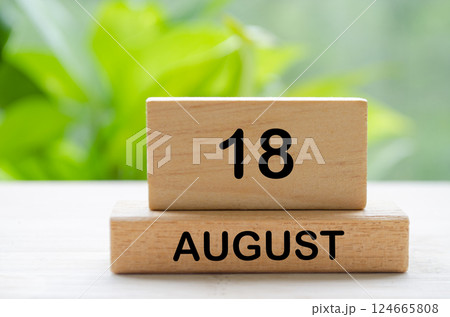August 18 text on wooden blocks with customizable space for text or ideas. August month and calendar concept. August 18 text on wooden blocks with customizable space for text or ideas. August month and calendar concept. 124665808