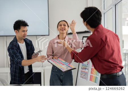Excitement and Innovation. Team members share enthusiasm during a feel-good design meeting. 124669262