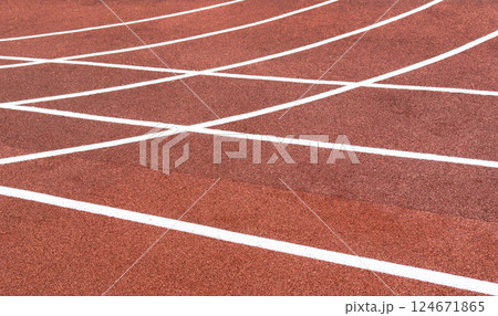Red treadmill with the lines at the stadium. Treadmill lane on sport field. Running track on the stadium. Red treadmill in sport field. Running track Red treadmill with the lines at the stadium. Treadmill lane on sport field. Running track on the stadium. Red treadmill in sport field. Running track 124671865
