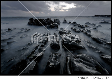 Long exposure landscape, dark sunset, low angle, rocky coast 124672012