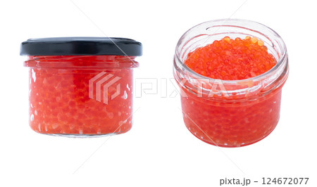 Red caviar in the glass jar isolated on a white background. Trout or salmon caviar close up. Macro shot. Red caviar in the glass jar isolated on a white background. Trout or salmon caviar close up. Macro shot. 124672077