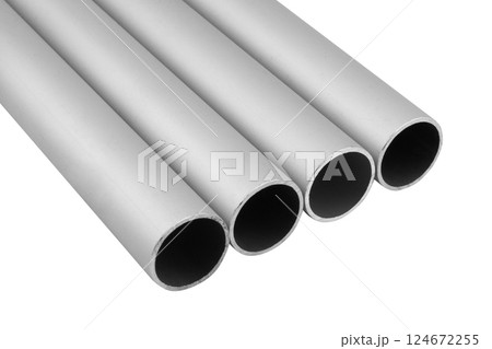 New high quality shiny galvanized stainless steel metal aluminium alloy pipes. Industrial construction materials isolated on white background. New high quality shiny galvanized stainless steel metal aluminium alloy pipes. Industrial construction materials isolated on white background. 124672255