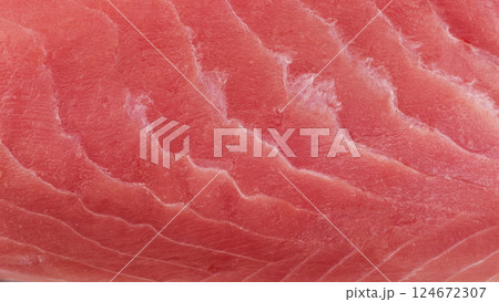 Macro shot yellow fin tuna steak background. Fresh rare steak close up. Raw yellowfin tuna fillet texture. Background fresh tuna meat. Slices of tuna meat Macro shot yellow fin tuna steak background. Fresh rare steak close up. Raw yellowfin tuna fillet texture. Background fresh tuna meat. Slices of tuna meat 124672307