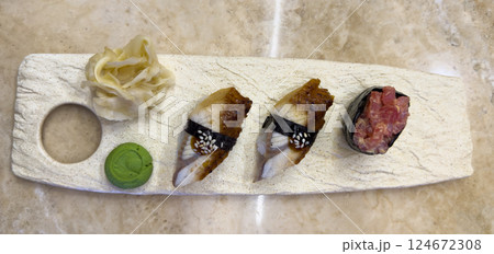 Nigiri sushi on marble plate. Delicious eel nigiri sushi. Nigiri sushi on marble plate. Delicious eel nigiri sushi. 124672308