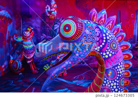 Vibrant Alebrije Dragon Art Installation in Neon Glow Eye-Level View 124673305