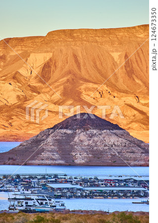 Golden Hour at Lake Mead Marina and Desert Mountains from Shoreline Golden Hour at Lake Mead Marina and Desert Mountains from Shoreline 124673350