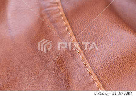 Leather texture background. Part of perforated brown leather details. Perforated leather texture background. Texture leather Leather texture background. Part of perforated brown leather details. Perforated leather texture background. Texture leather 124673394